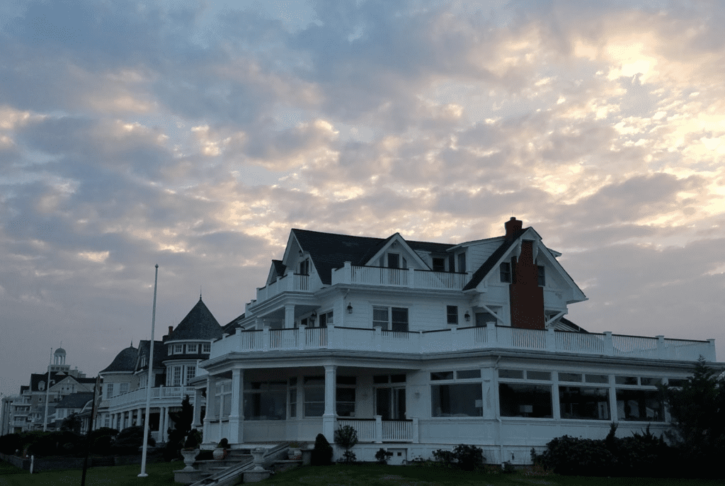 A white victorian house at sunset.