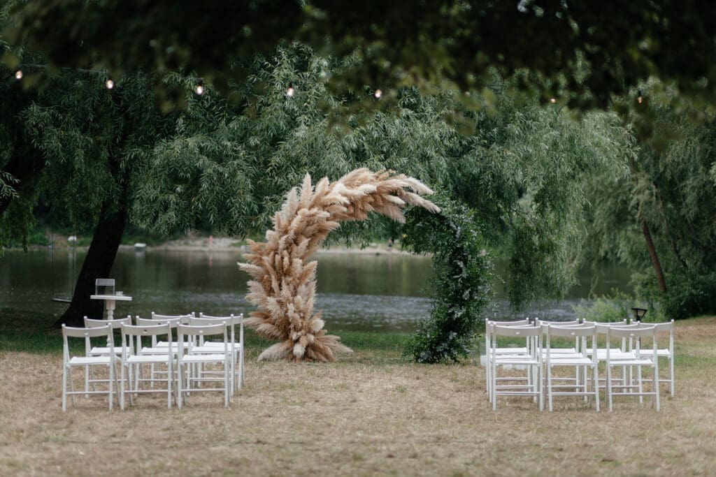 A wedding ceremony set up in a grassy area.