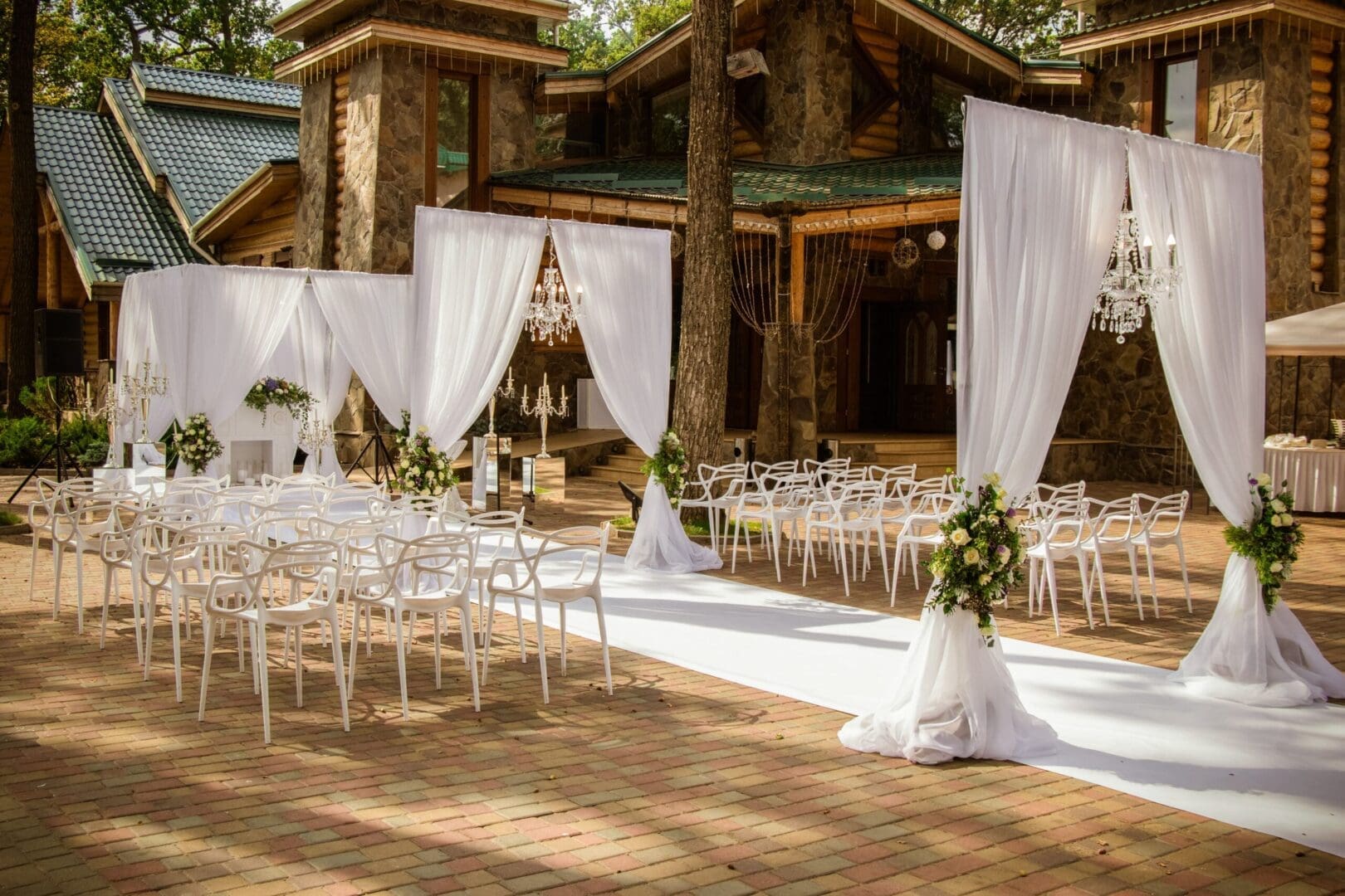 A wedding ceremony set up in a wooded area.