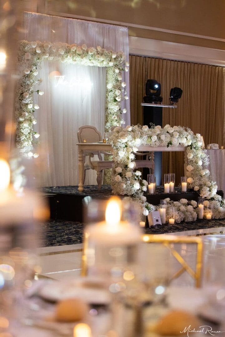 A wedding reception set up with candles and flowers.