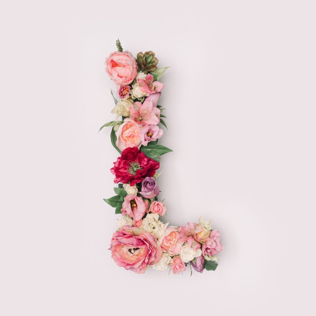 Flowers make up the letter l on a white background.