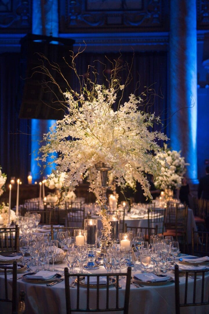 A wedding table scape with white flowers.