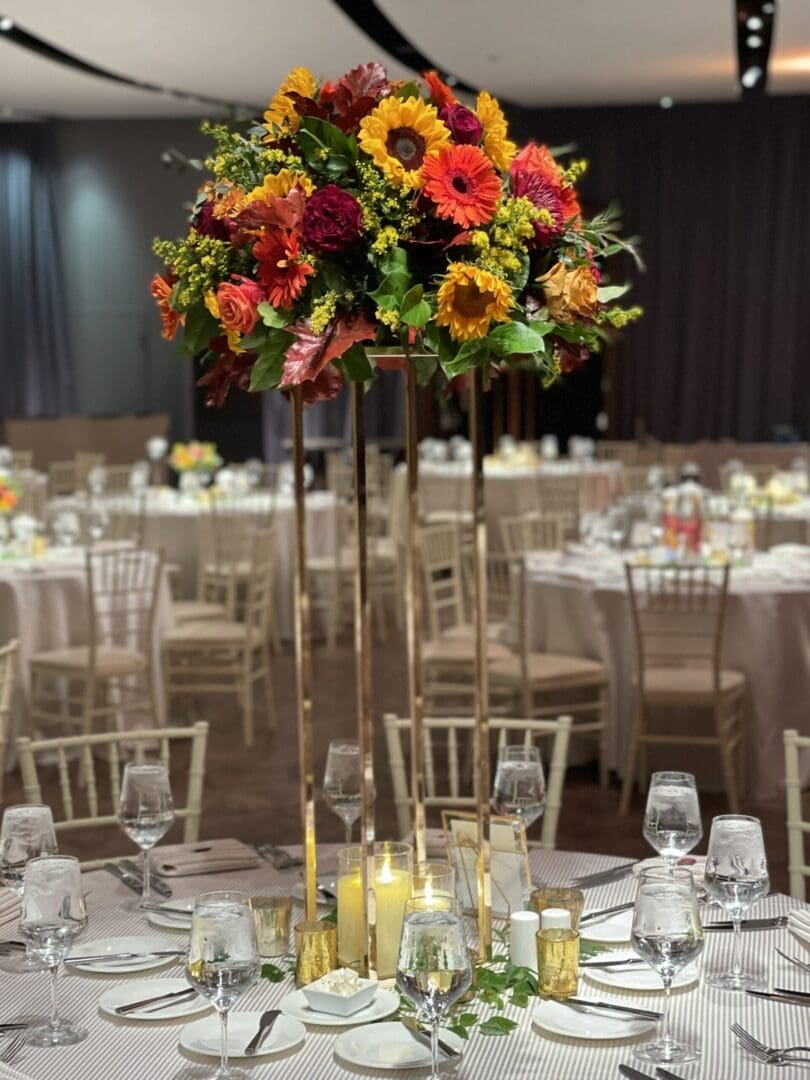 A stunning tablescape adorned with flowers and candles, perfect for a wedding reception.