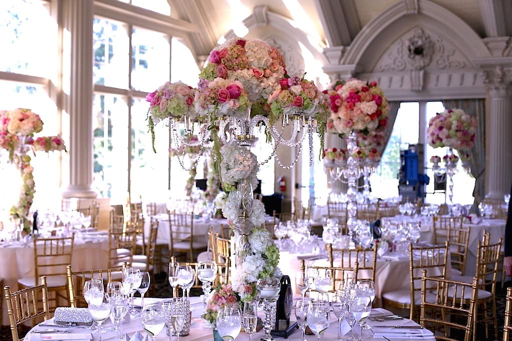 A stunning wedding tablescape adorned with an abundance of pink and white flowers.